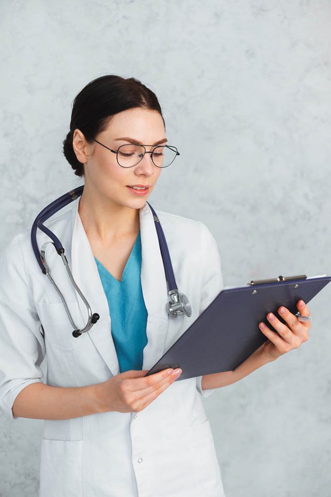 Female doctor holding stethoscope